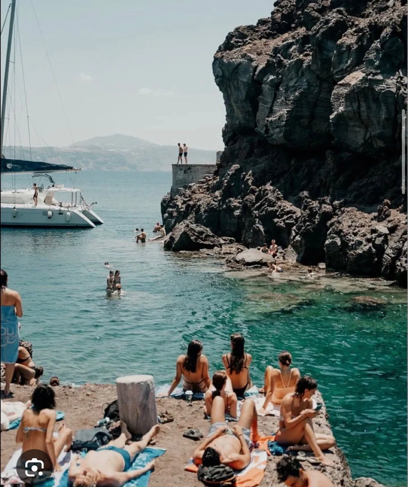 Ammoudi Bay in Santorini with clear blue water and volcanic cliffs