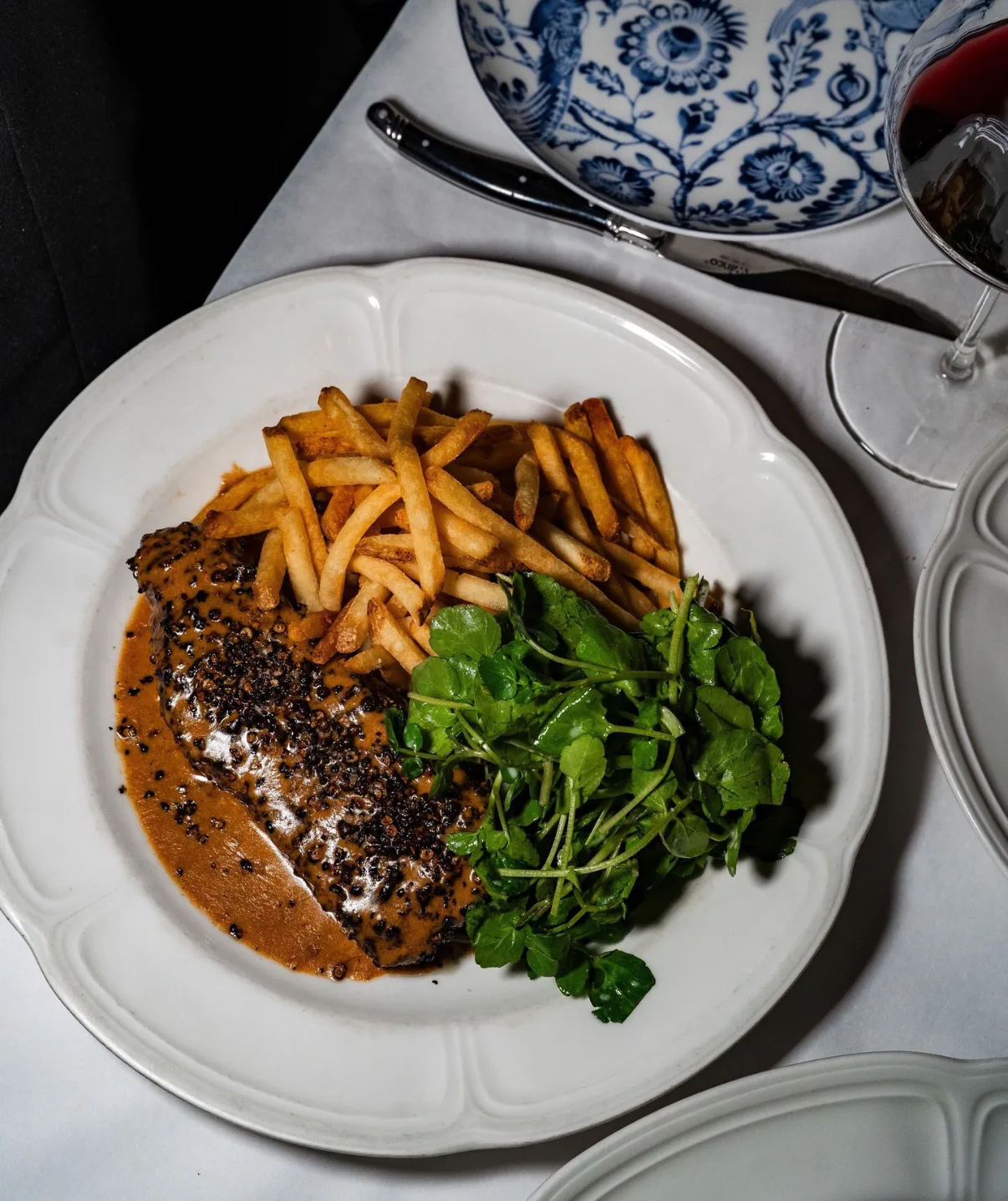 Steak au poivre and frites at Raoul’s in New York