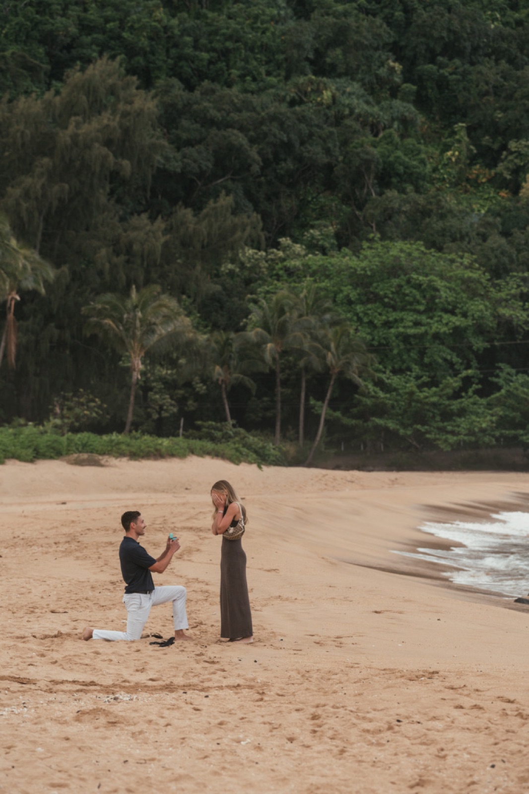 Jimmy proposing to Lauren on Tunnels Beach in Kauai